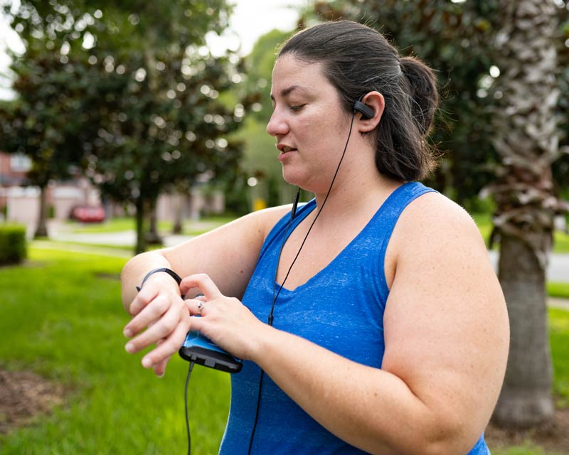 Woman checking smartwatch